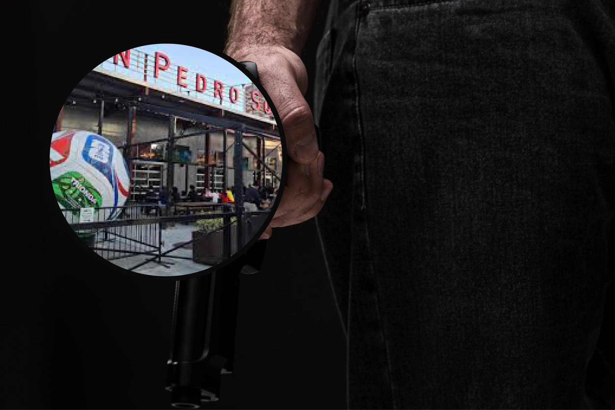 Person in dark clothing holding a handgun, with a circular inset of a crowded outdoor fair behind a fence behind them? Wait—rephrase: 'Person in dark clothing holding a handgun, with a circular inset showing a crowded outdoor fair behind a fence.'