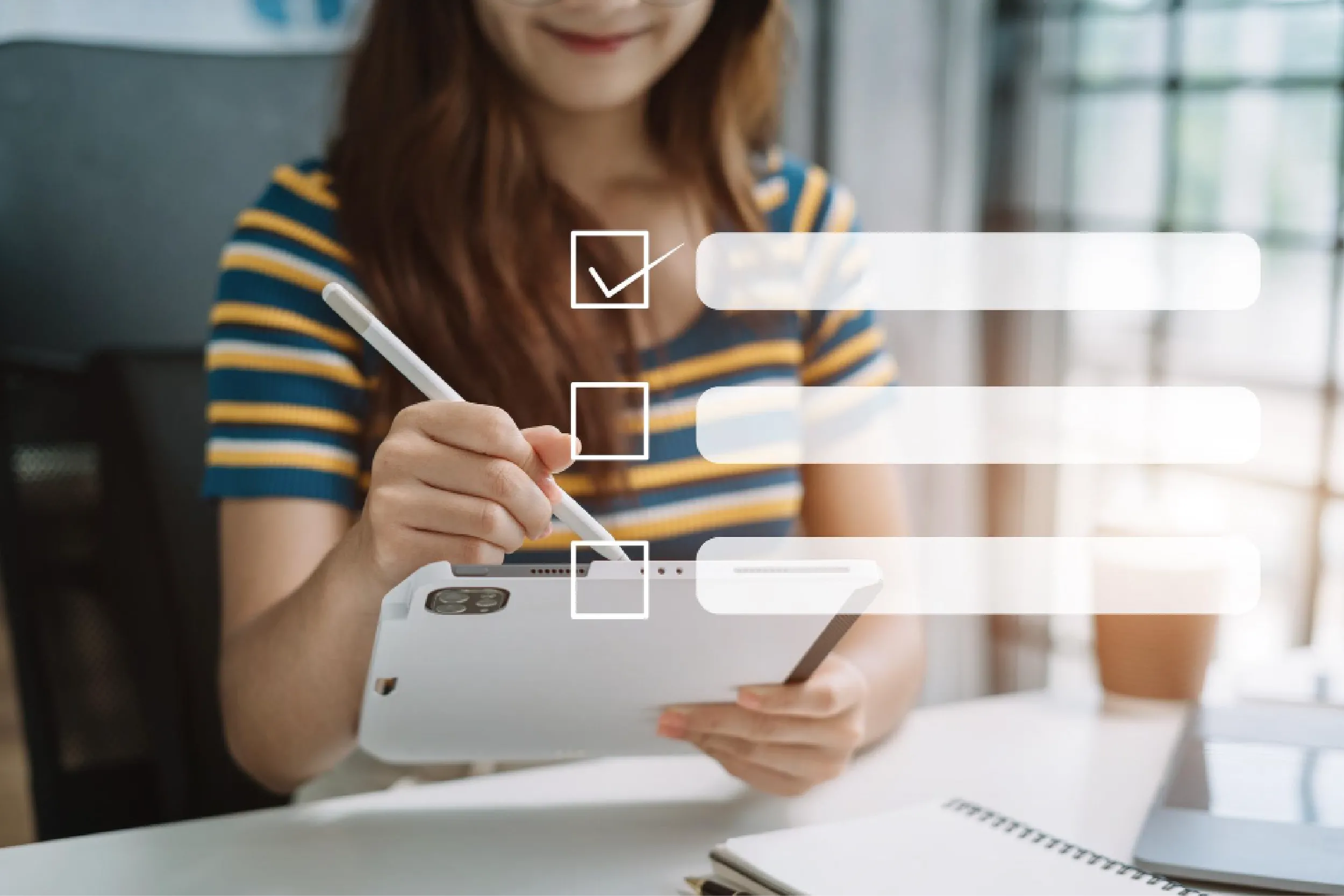 Person in a striped shirt uses a stylus on a tablet, with floating form fields overlaying the screen (data entry).