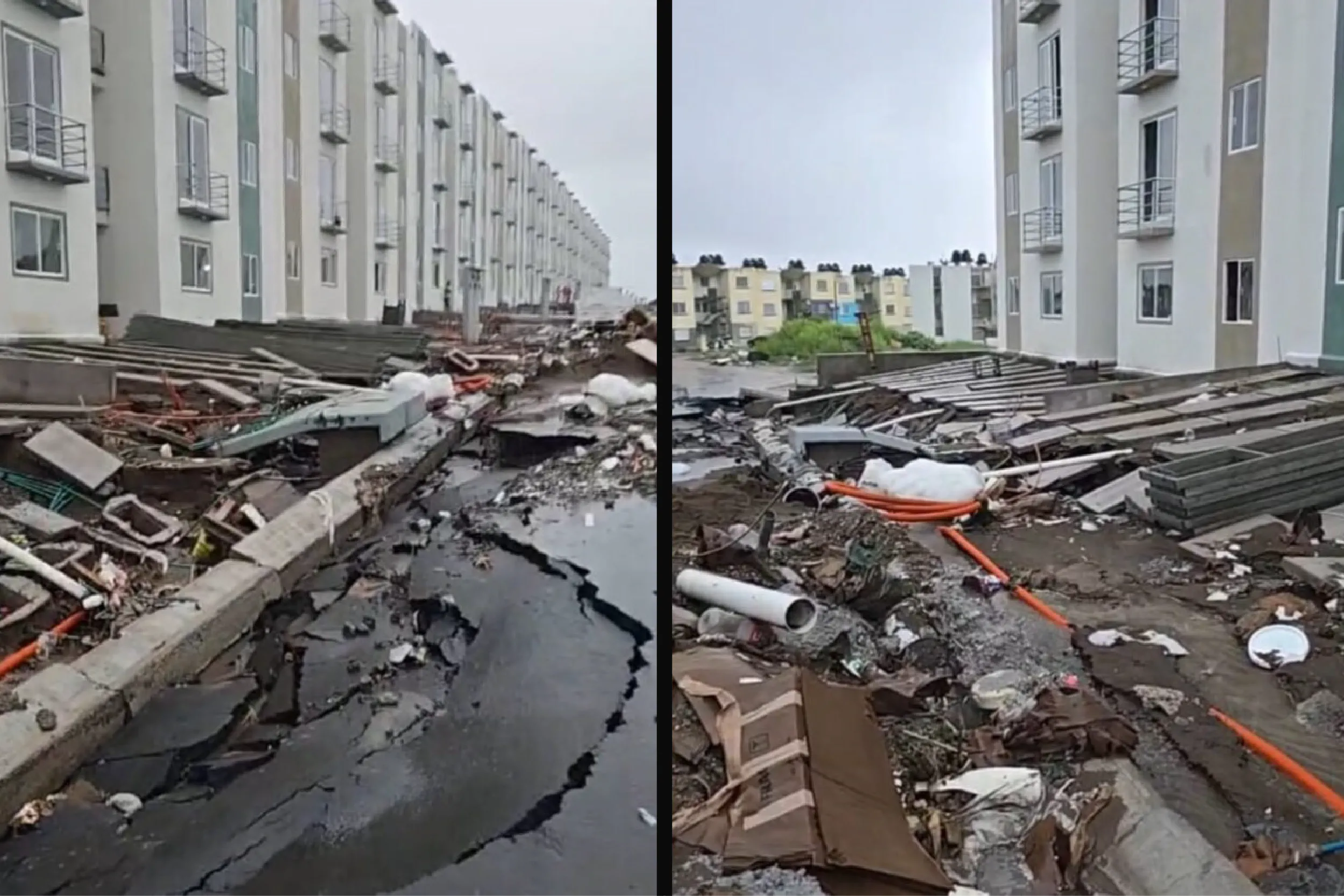 Rubble and collapsed construction debris line a street between damaged apartment buildings on both sides, showing a scene of destruction.