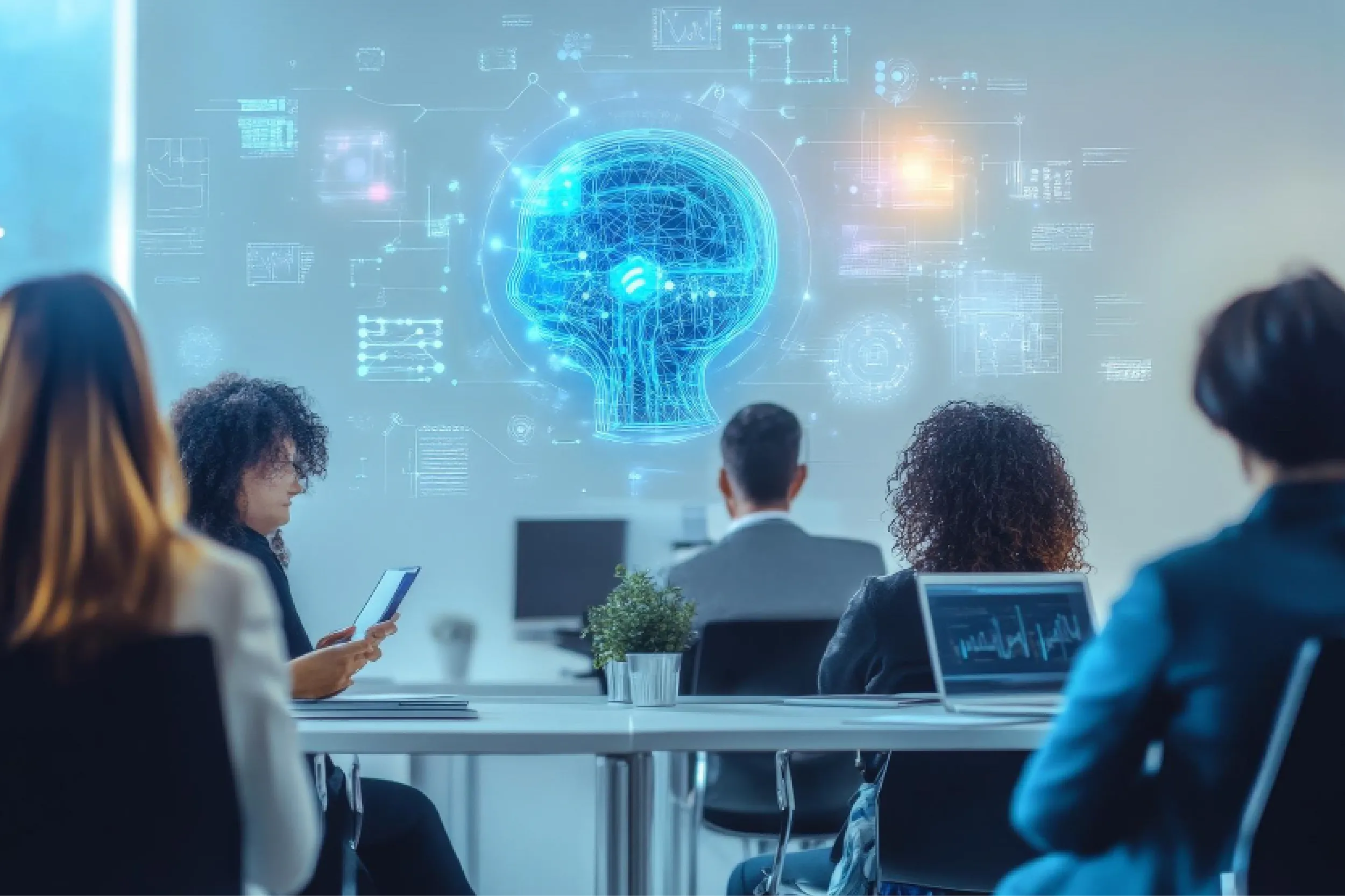 Team of professionals in a meeting viewing a glowing blue brain hologram projected on the wall.